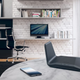 A photo of the Netgear RAXE300 on a tablet with furnishings in the background